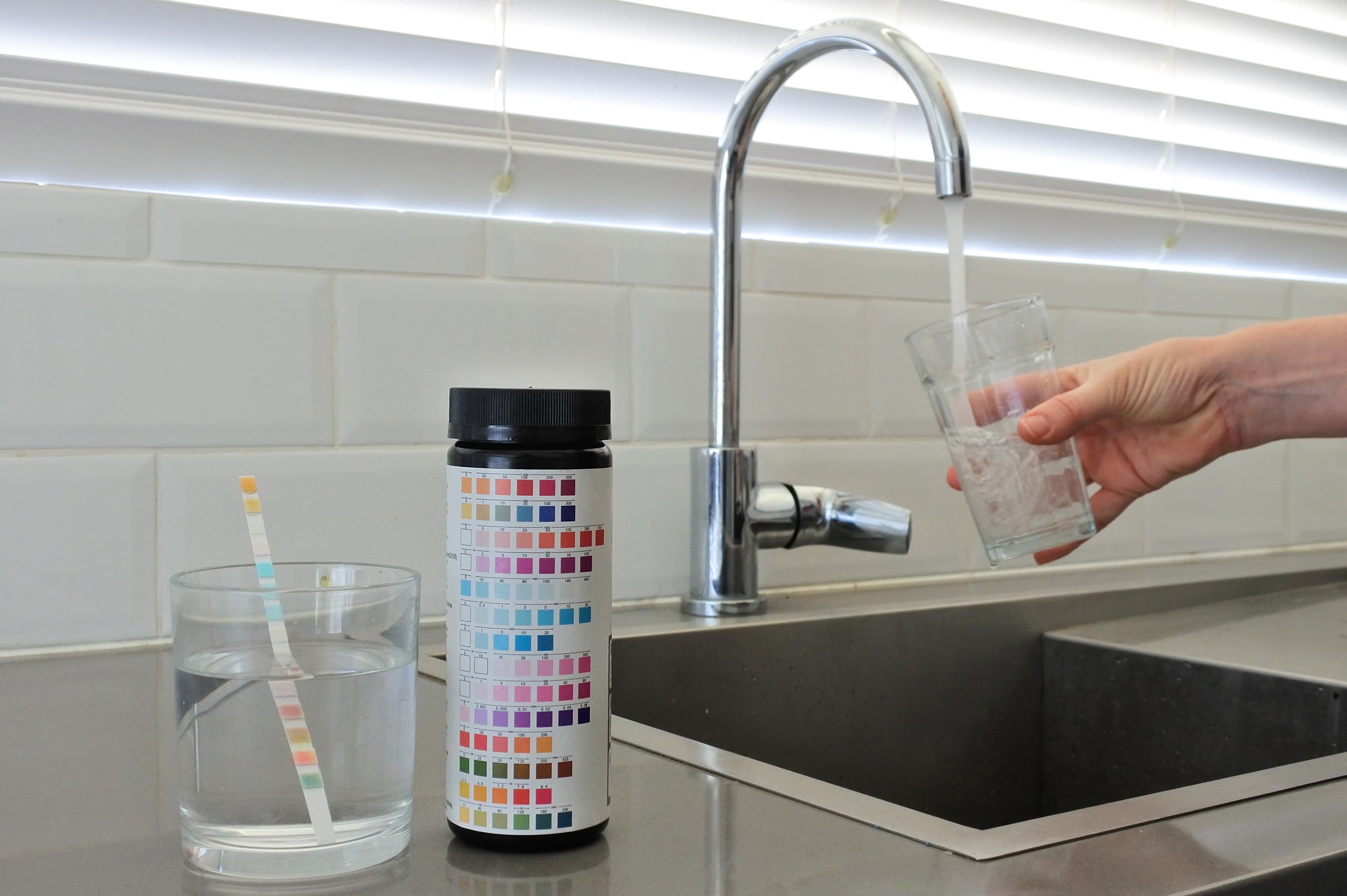 Water testing technician analyzing a sample of Wilmington tap water